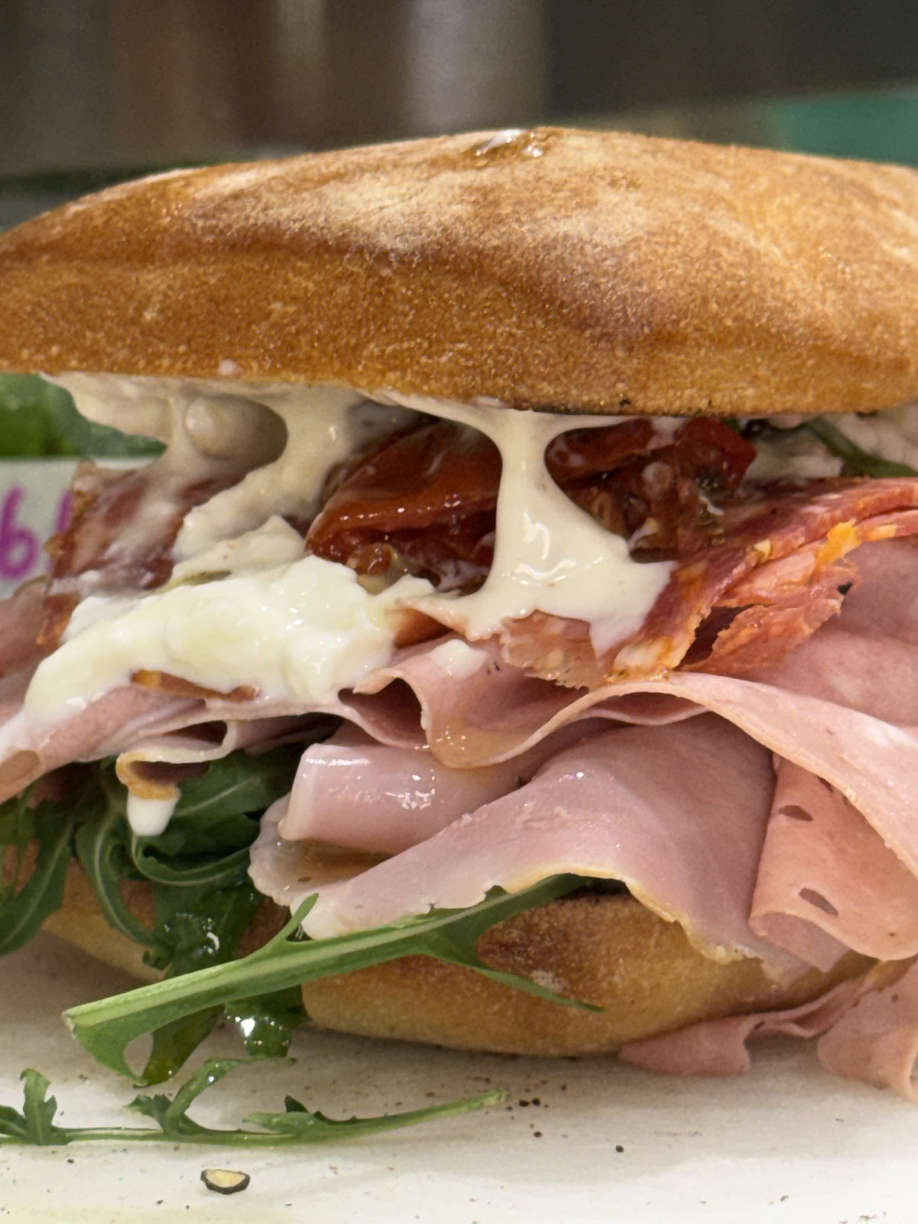 Ham, salami and sundried tomato sandwich with rocket