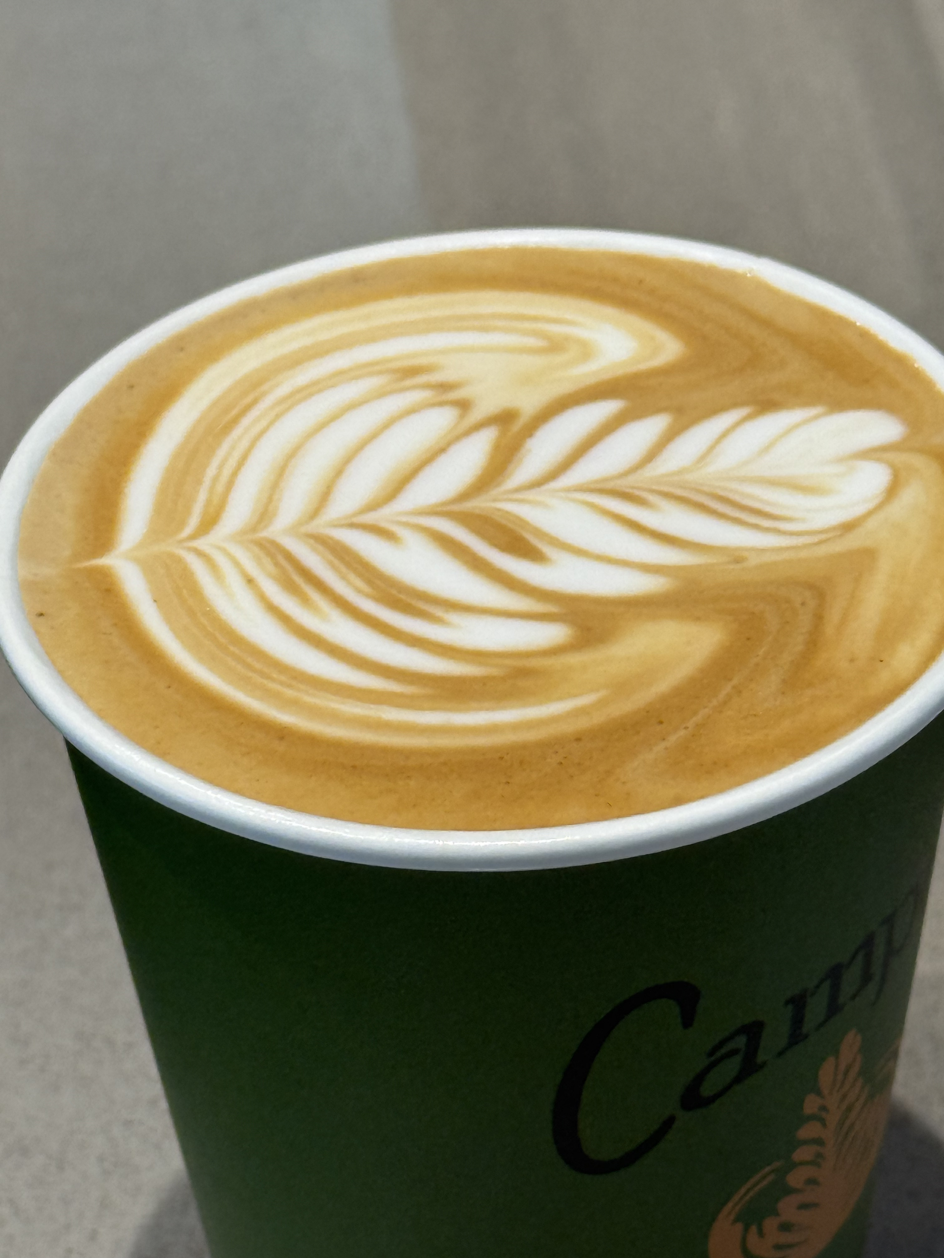 Latte art in a Campos takeaway cup
